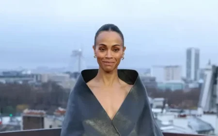 Zoe Saldaña Elevates Fashion with Chic Funnel Neck Coat