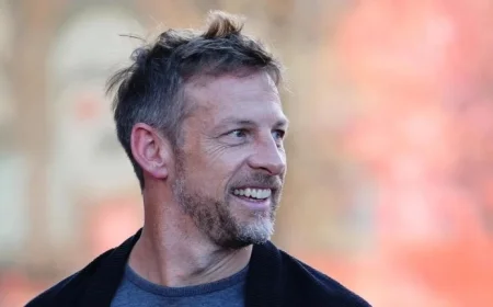 Former McLaren Driver Button Urges Supporting Teammates on the Track