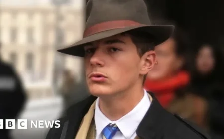 Unravel the Mystery: Fedora-Wearing Man Photographed Outside the Louvre