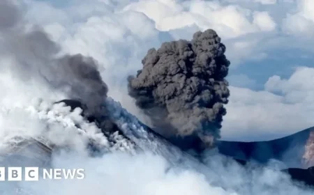 Skiers Glide as Snow-Capped Mount Etna Erupts