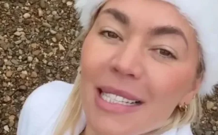 Danni Menzies Braves Lake Dip in Skimpy Red Bikini