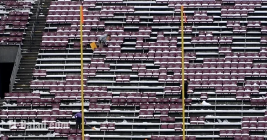UM Clears Washington-Grizzly Stadium Snow for Playoff Game Preparation