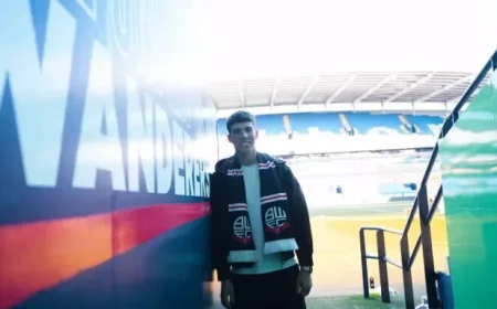 Lewis Secures Victory