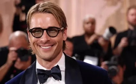 Glen Powell Stuns in Midnight Blue Tux at Golden Globes Arrival