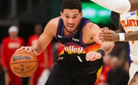 Devin Booker Exits Game with Right Ankle Injury as Teammate Falls