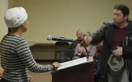 Assailant Attacks Rep. Ilhan Omar with Substance at Town Hall