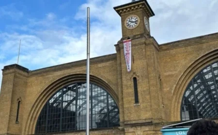 Protester Climbs King’s Cross Station as Firefighters Respond
