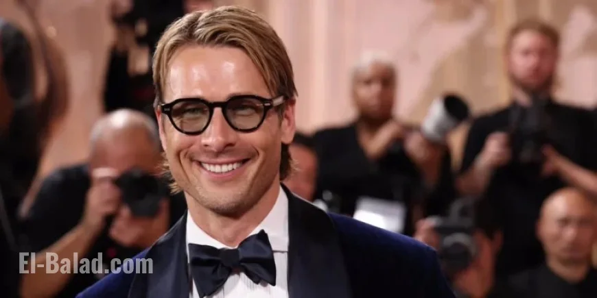 Glen Powell Stuns in Midnight Blue Tux at Golden Globes Arrival