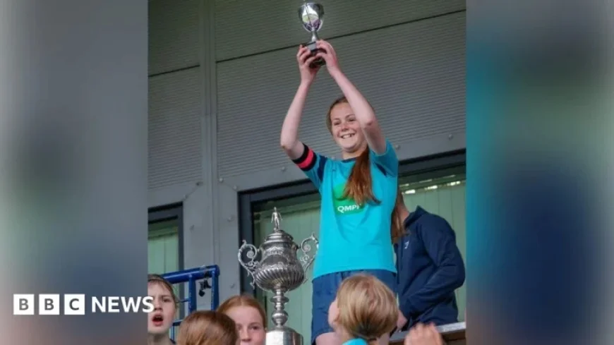 Girls’ Football Team Awarded Small Cup, Boys Win Full-Size Trophy