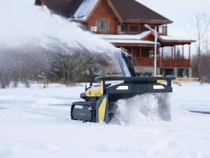 Autonomous Snow Blower Efficiently Clears Driveway Amid Storm