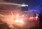 Hooded Protesters Clash with Police Amid Milan Olympics Fireworks