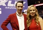 Tara Lipinski Shines in White Dress Beside Johnny Weir’s Green Olympic Outfit