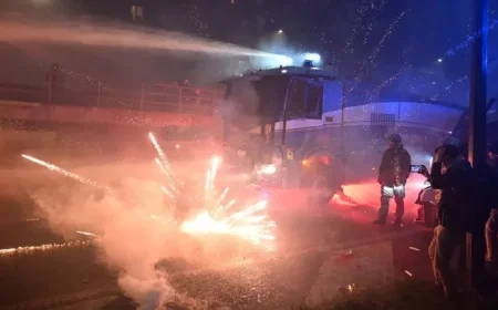 Hooded Protesters Clash with Police Amid Milan Olympics Fireworks