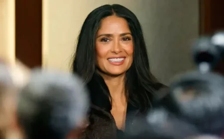Salma Hayek Showcases Gray Roots at Event with Claudia Sheinbaum