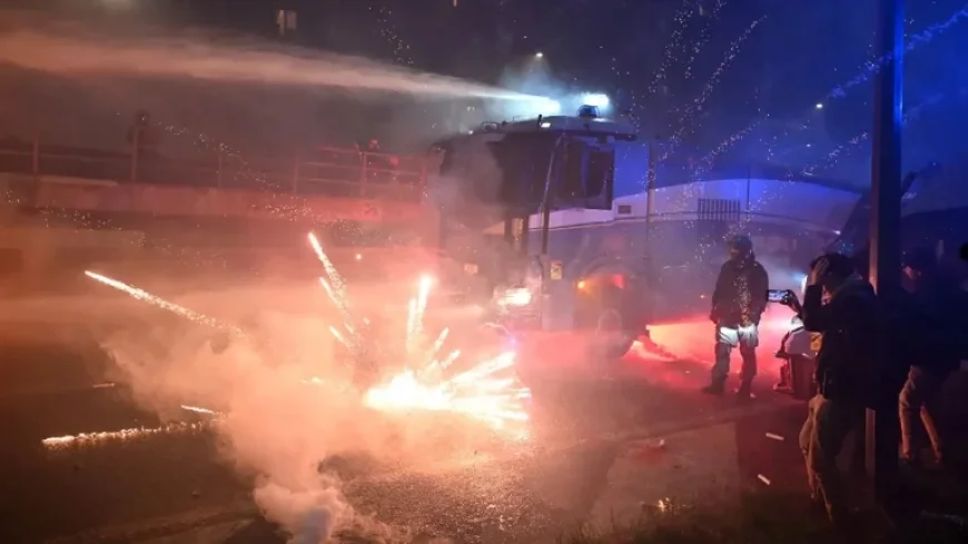 Hooded Protesters Clash with Police Amid Milan Olympics Fireworks
