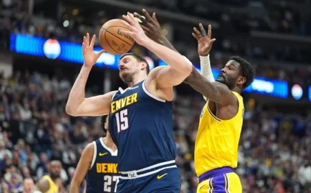 Lakers’ Deandre Ayton leaves game against Nuggets with knee injury
