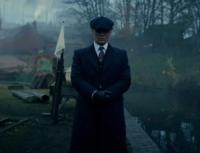Peaky Blinders The Immortal Man: A pub door swings open, and Tommy Shelby walks back into war