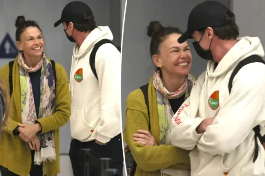 Hugh Jackman and Sutton Foster Arrive at LAX, Radiating Love