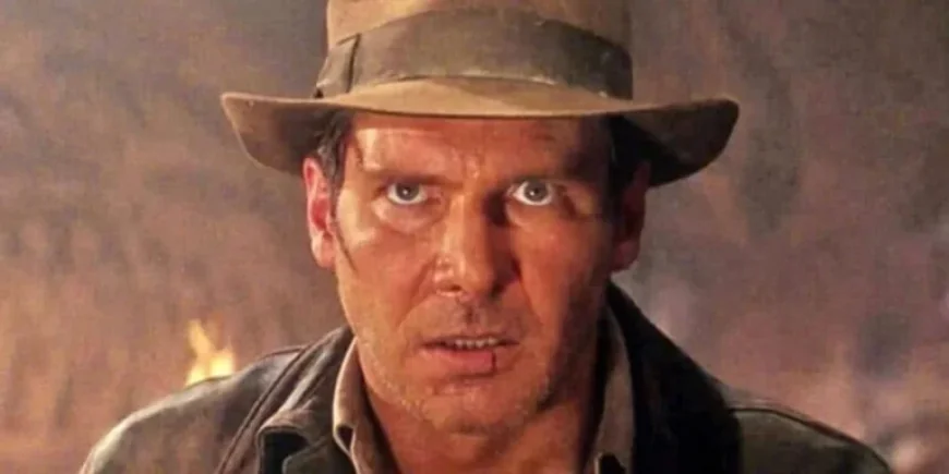 Indiana Jones kiosk construction and a boulder-less stunt: a park corner that quietly tells a larger story