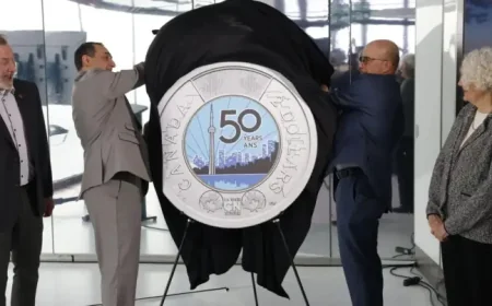Cn Tower glow-in-the-dark toonie now circulating: a landmark shrunk to pocket size