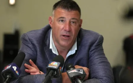 Patriots’ Mike Vrabel Responds to Viral Photos with NFL Reporter