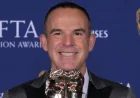 Lara Lewington supports Martin Lewis at the BAFTAs after award