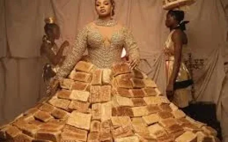 Queen Mercy Atang Turns 500-Loaf Bread Dress Into AMVCA Promo