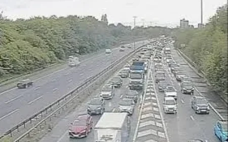 M60 clockwise closed between junctions 22 and 23 after car blocks road