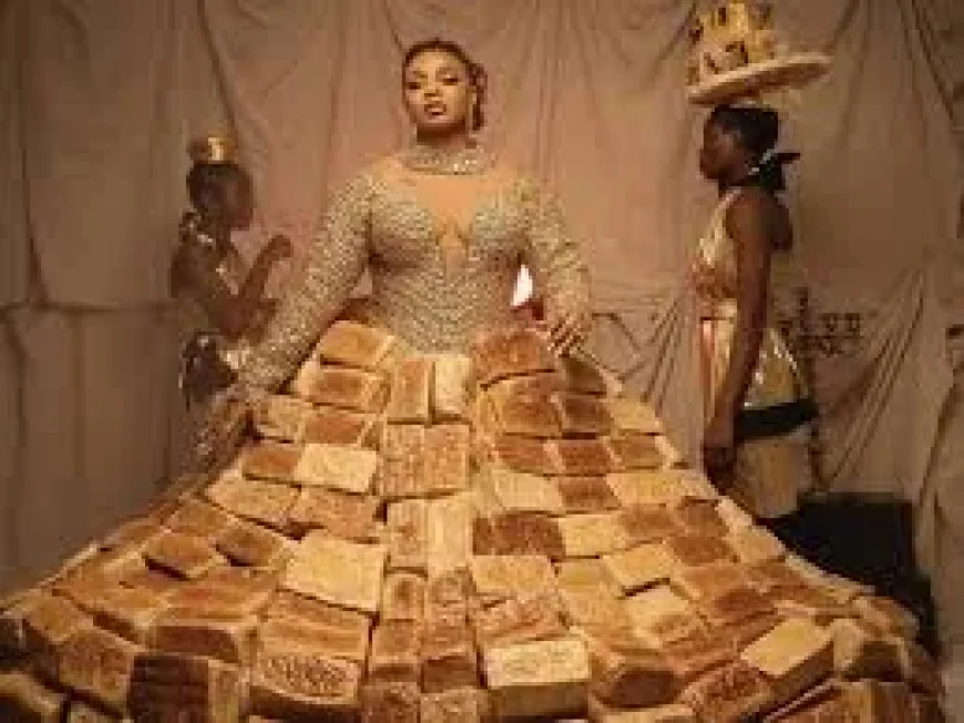 Queen Mercy Atang Turns 500-Loaf Bread Dress Into AMVCA Promo