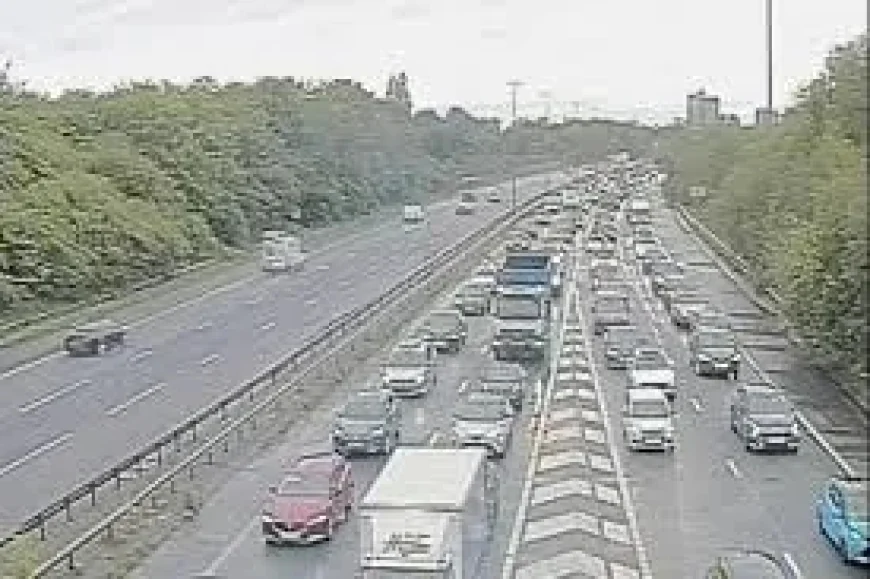 M60 clockwise closed between junctions 22 and 23 after car blocks road