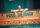 Abbey Clancy joins Deliveroo in 6ft 7in Pizza Crouch push